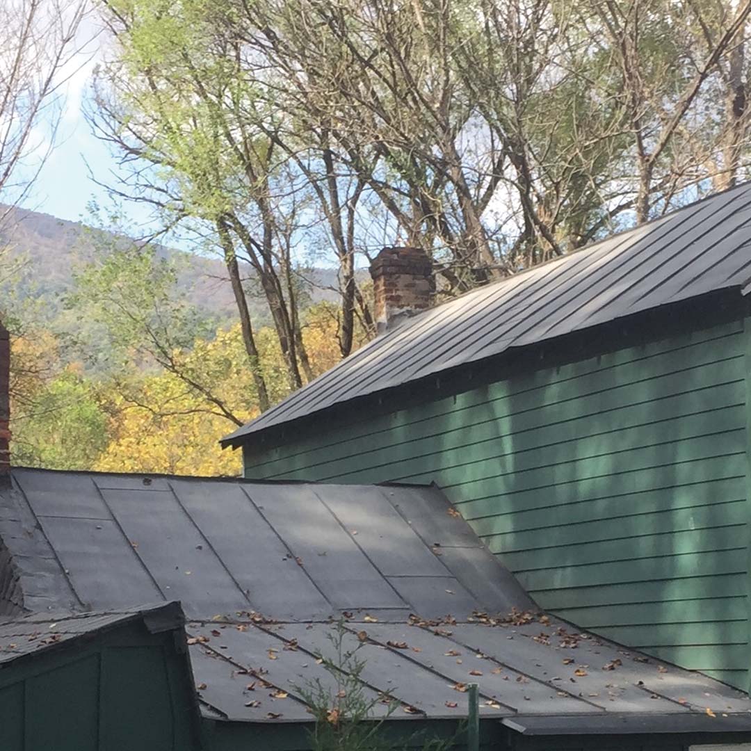 SEMCO Liquid Membrane sealing seams on a metal roof before winter rain